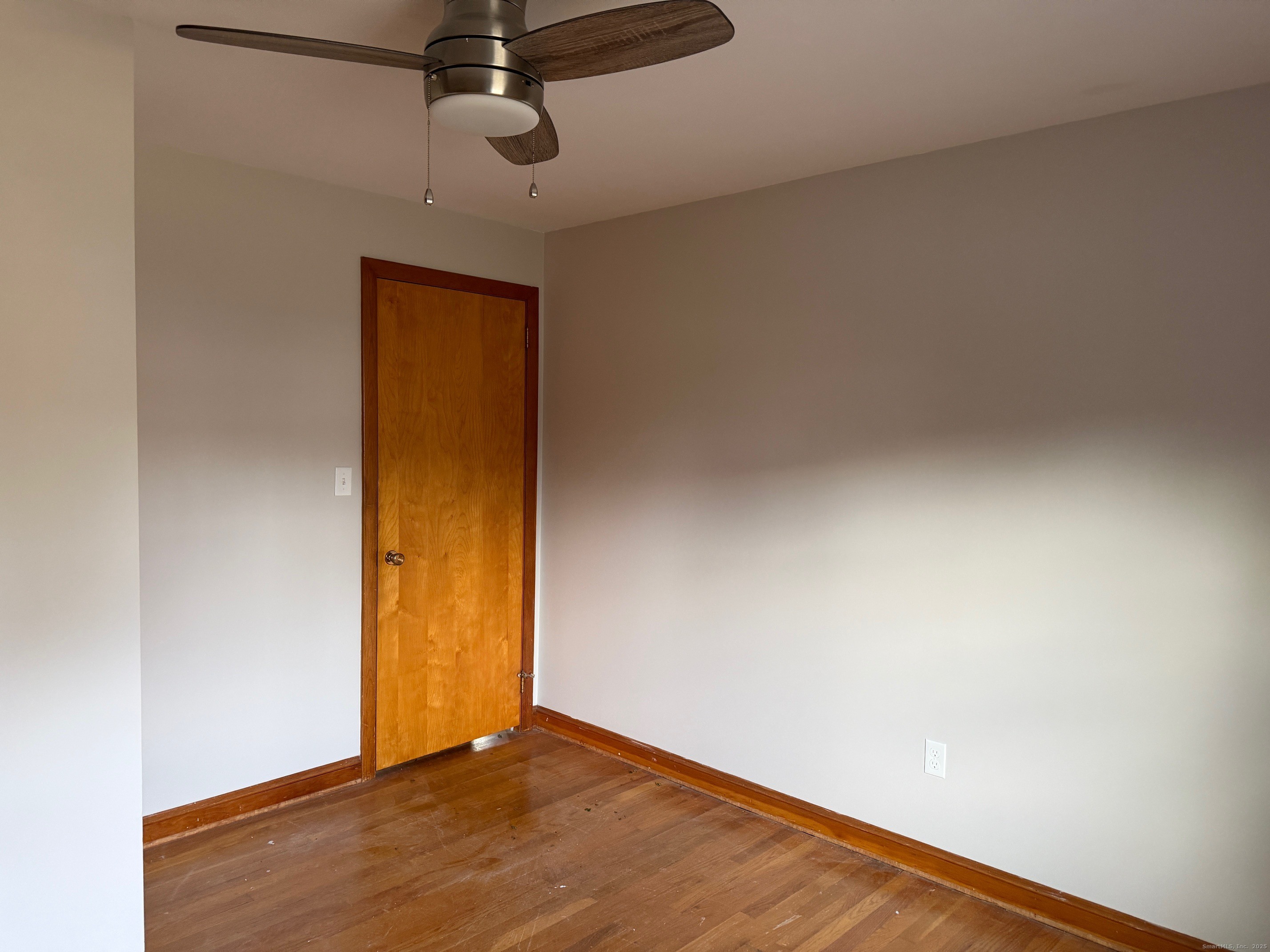 36 Colonial Drive Prospect, CT 06712 - Photo 7 of 18 a view of an empty room with wooden floor