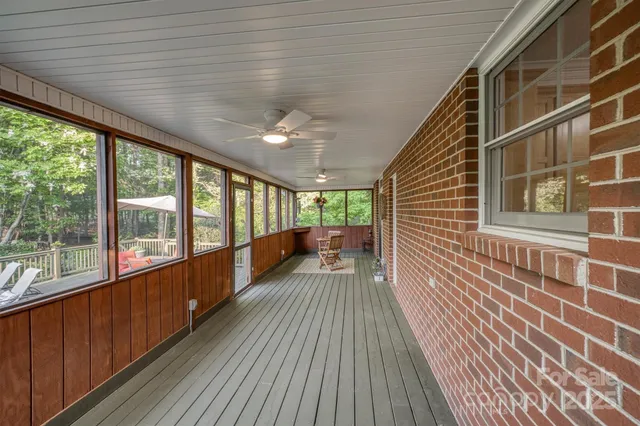 a view of a balcony with wooden floor