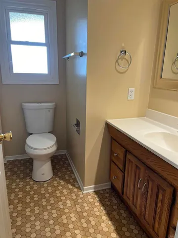 a bathroom with a toilet and a sink