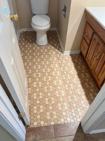 a bathroom with a toilet and a sink