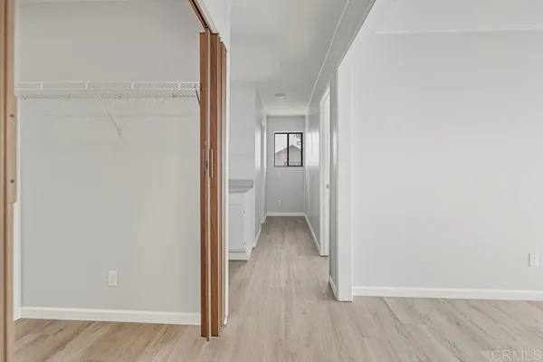 a view of a patio with table and chairs with wooden fence