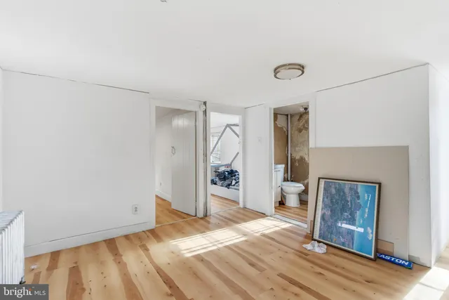 a view of livingroom with hardwood and front door