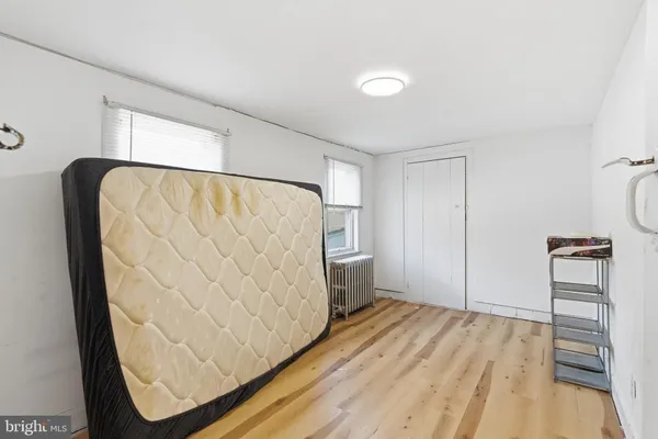 a bathroom with a sink vanity mirror and toilet