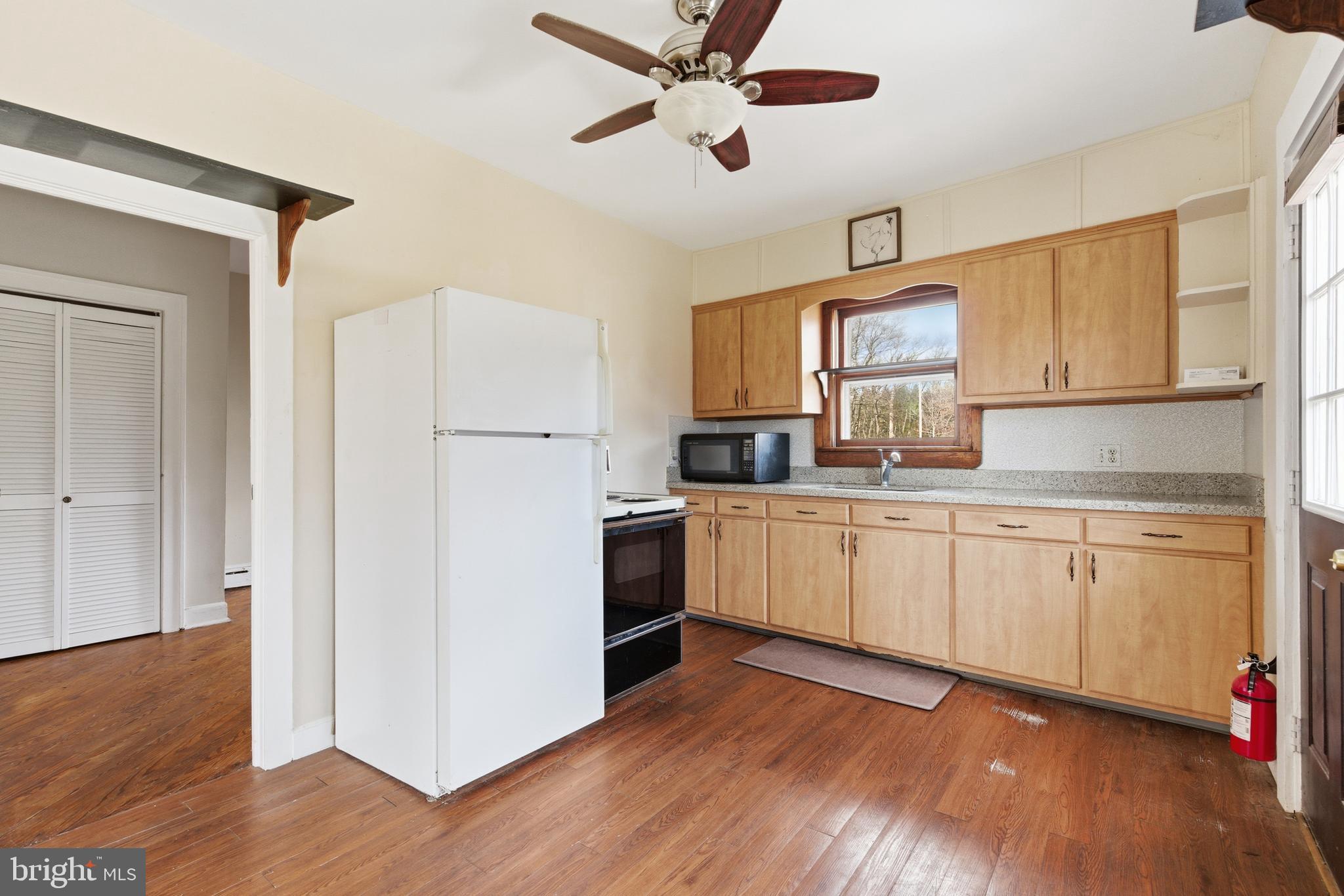 19 Thatcher Road Frenchtown, NJ 08825 - Photo 17 of 41 a kitchen with a refrigerator cabinets and wooden floor