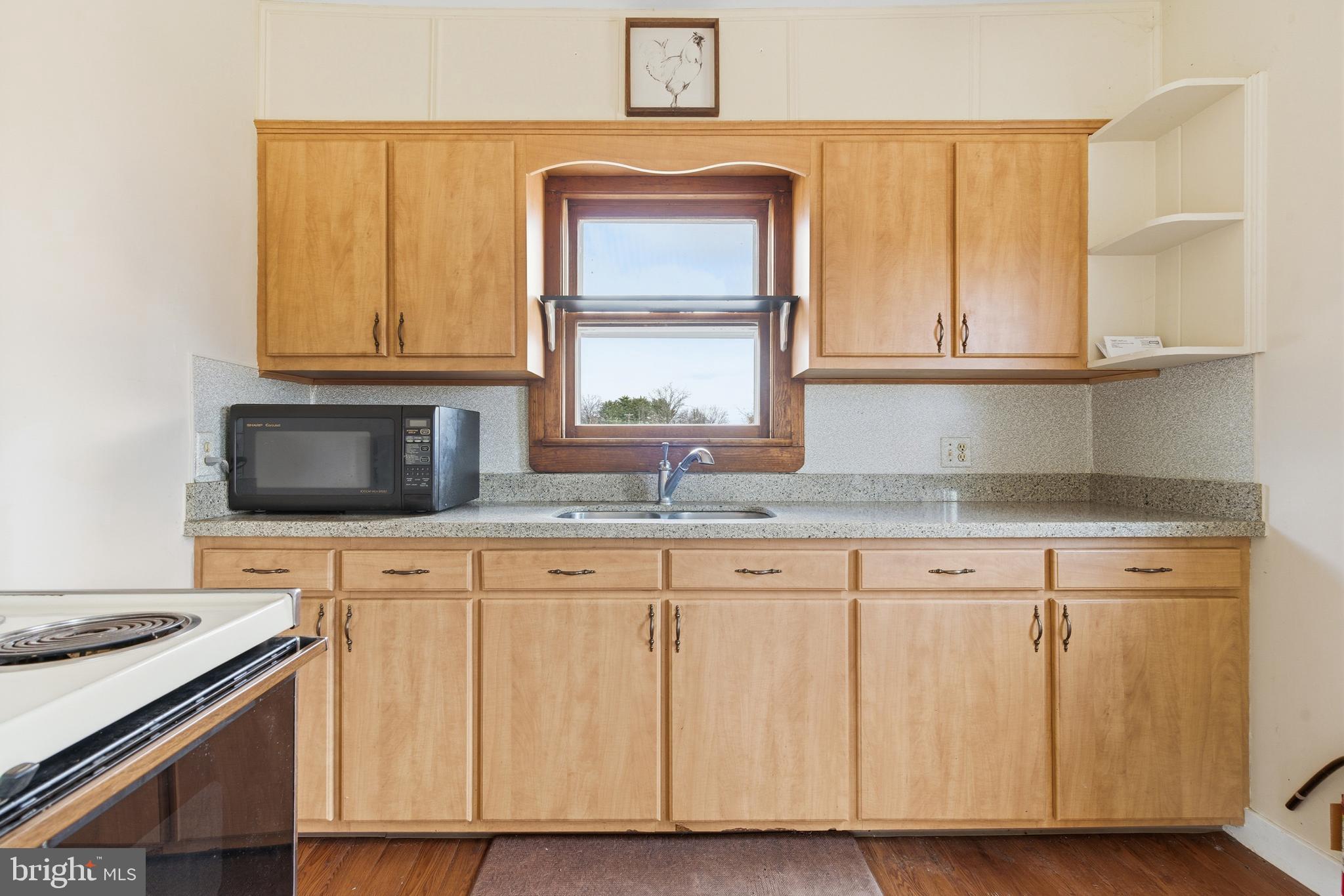 19 Thatcher Road Frenchtown, NJ 08825 - Photo 18 of 41 a kitchen with granite countertop wooden cabinets a sink and a window