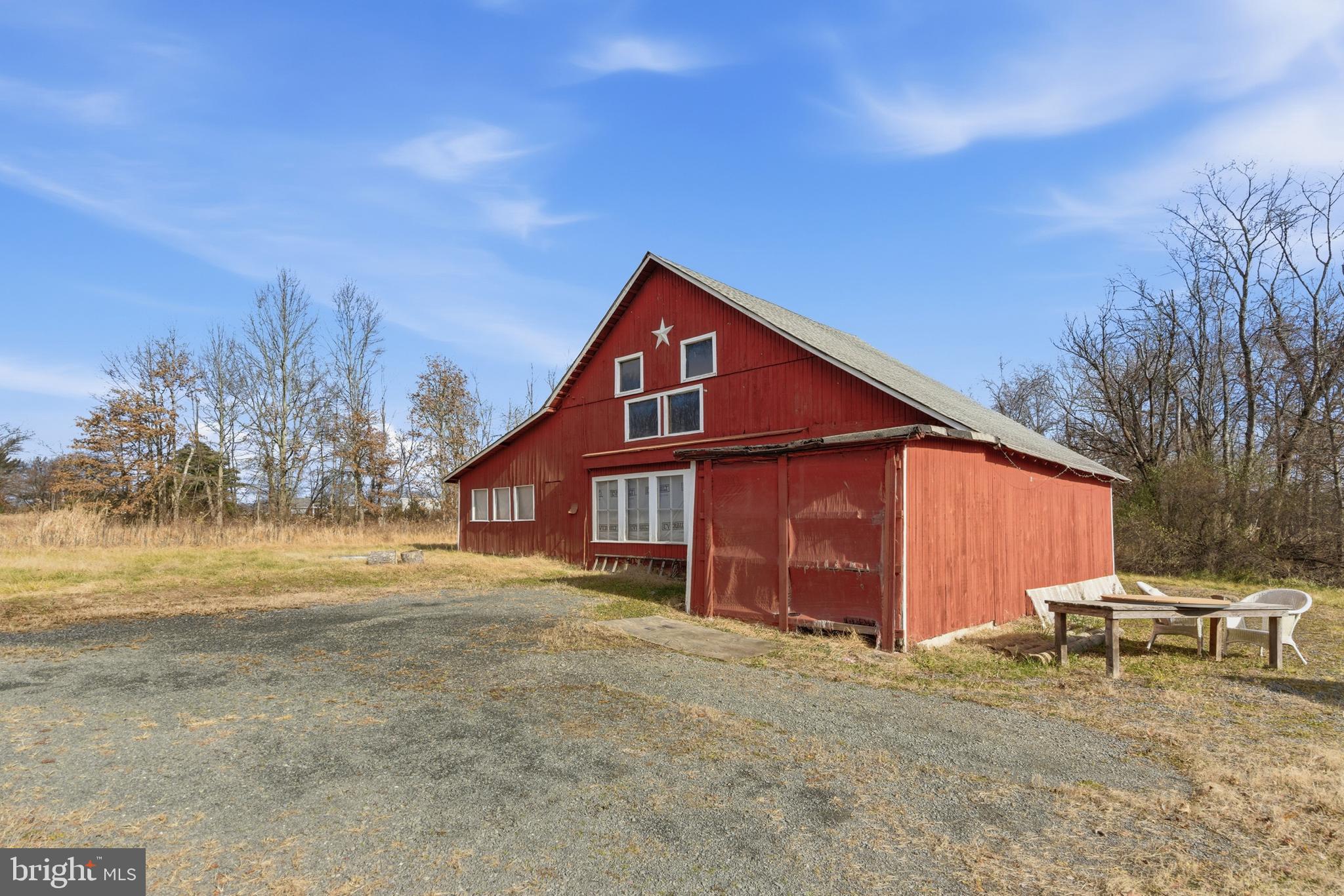 19 Thatcher Road Frenchtown, NJ 08825 - Photo 26 of 41 a backyard of a house with table and chairs