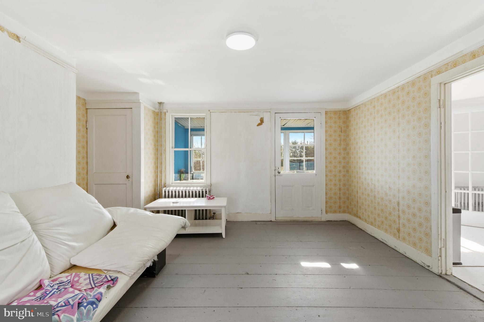 19 Thatcher Road Frenchtown, NJ 08825 - Photo 7 of 41 a living room with furniture and a window