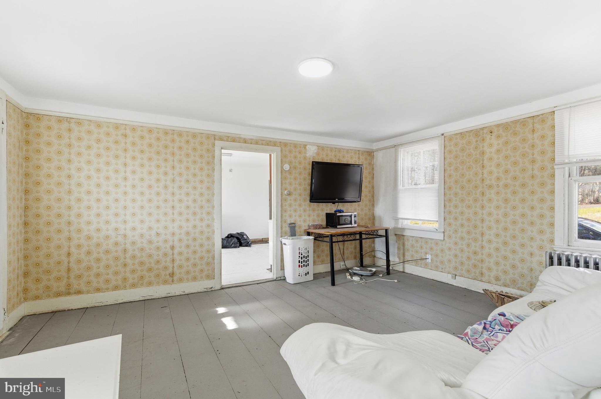 19 Thatcher Road Frenchtown, NJ 08825 - Photo 8 of 41 a living room with furniture and a flat screen tv