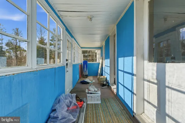 a view of a hallway with windows