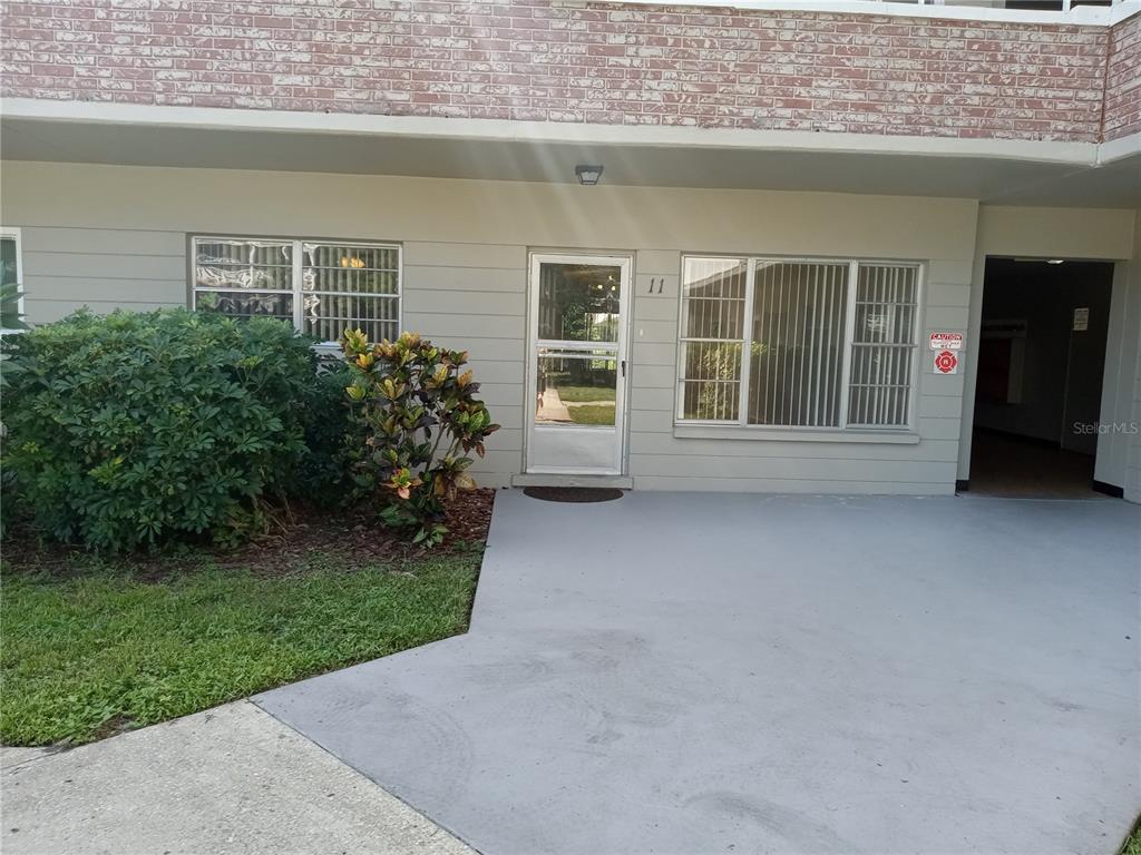 2427 Rhodesian Drive, Unit 11 Clearwater, FL 33763 - Photo 2 of 44 a view of a house with a garden