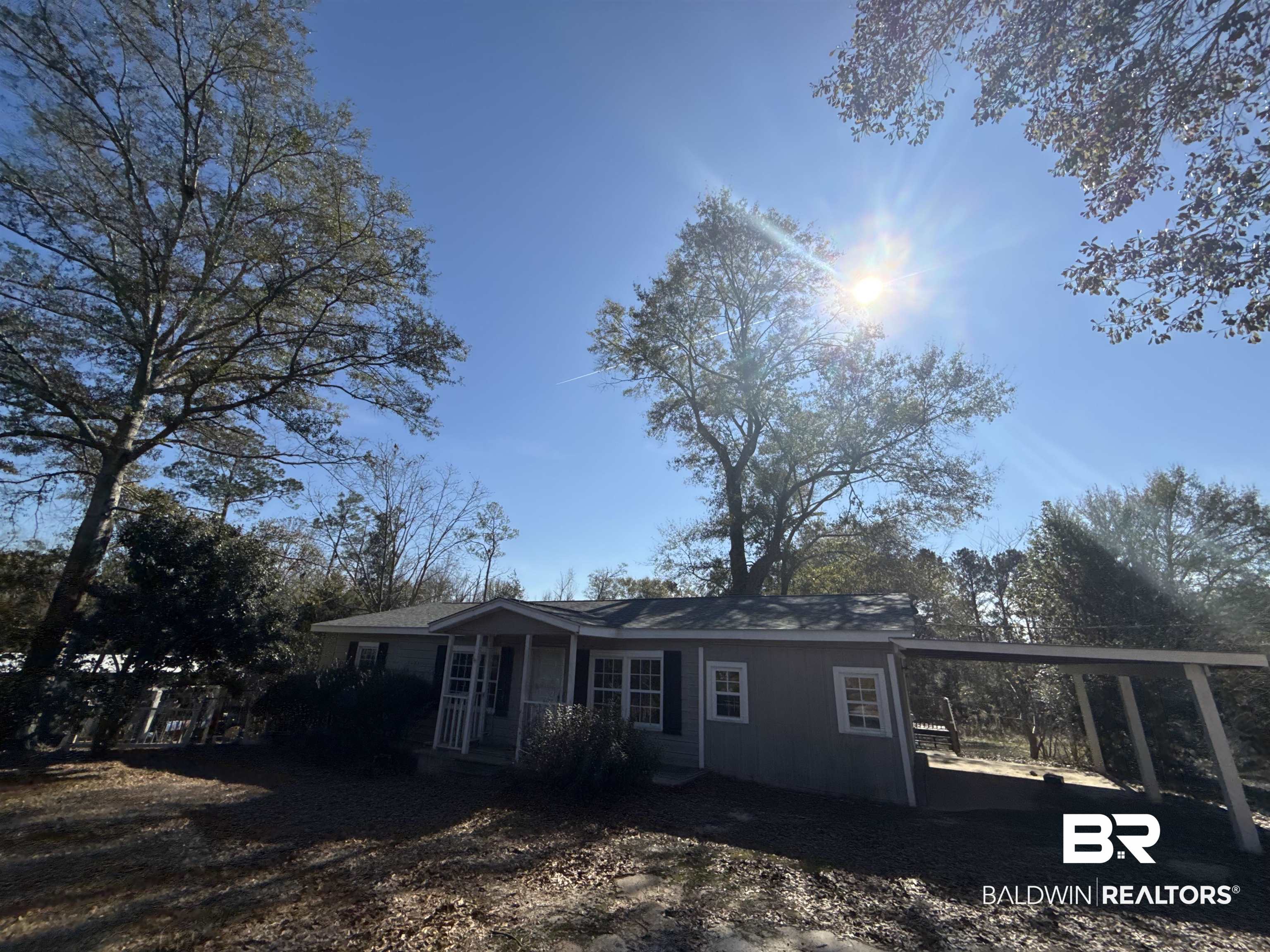 32 Slate Street Atmore, AL 36502 - Photo 1 of 16 View of front of property with a carport