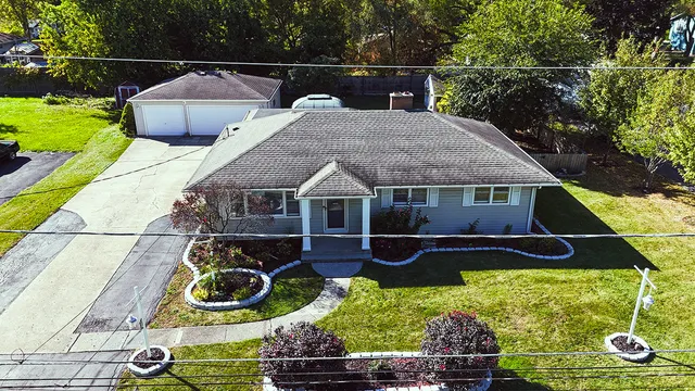 a aerial view of a house with swimming pool