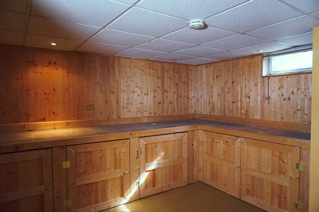 a kitchen with a sink and cabinets