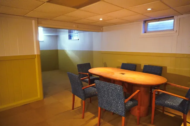 a patio with a table and chairs