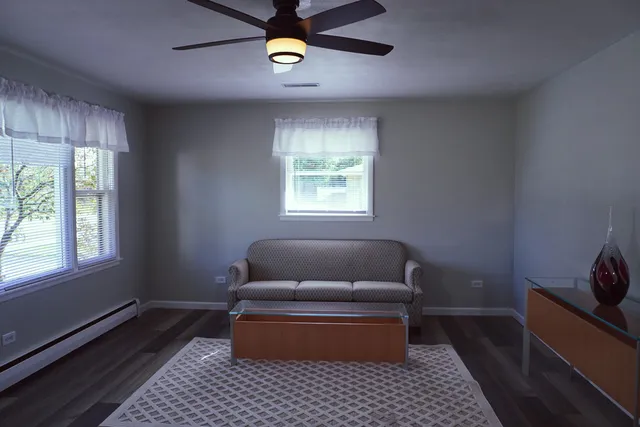 a living room with furniture and a window