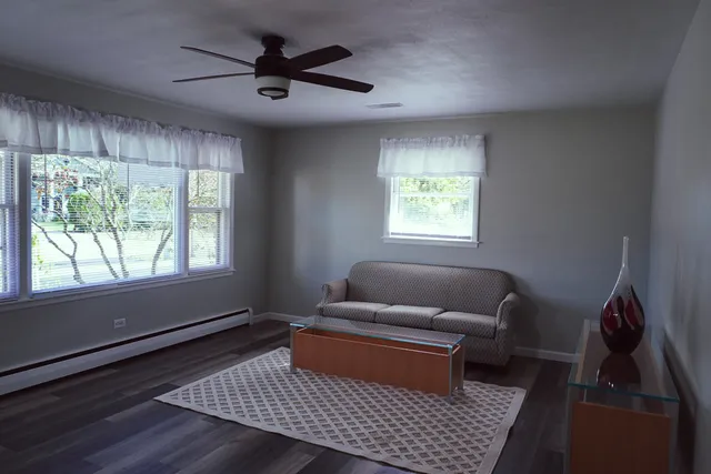 a living room with furniture and a window