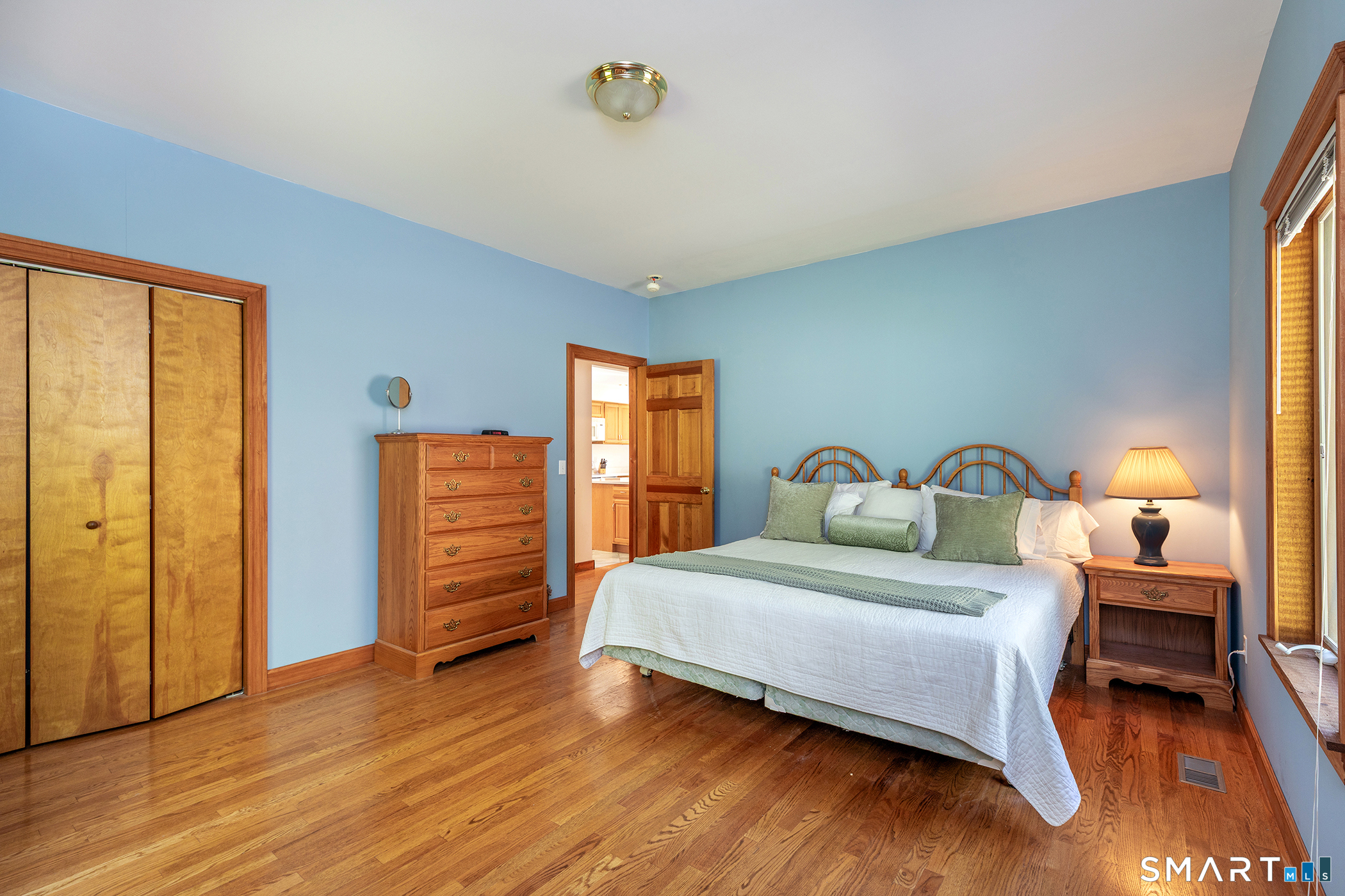 3 Old Forest Road Sherman, CT 06784 - Photo 12 of 38 a bedroom with a bed and wooden floor