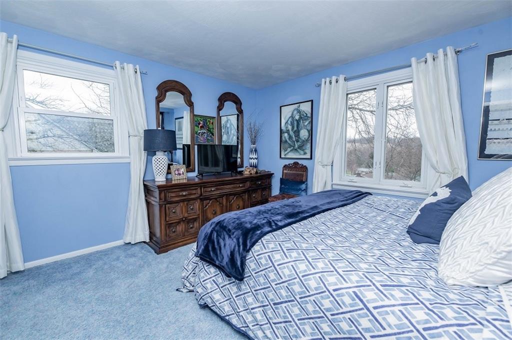 2740 Rebecca Street Indiana, PA 15701 - Photo 20 of 25 a bedroom with a bed and large windows