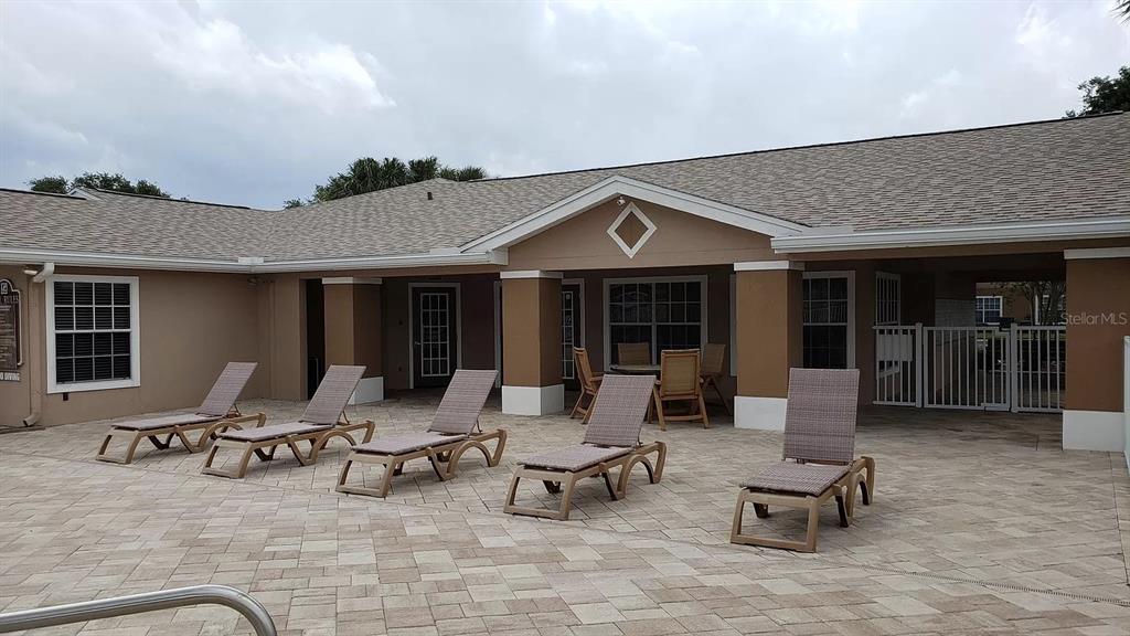 1830 Long Iron Drive, Unit 701 Rockledge, FL 32955 - Photo 12 of 18 a building outdoor space with patio furniture and potted plants
