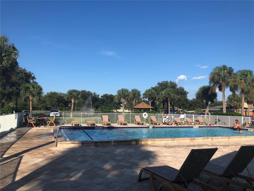 1830 Long Iron Drive, Unit 701 Rockledge, FL 32955 - Photo 18 of 18 a view of a lake with houses