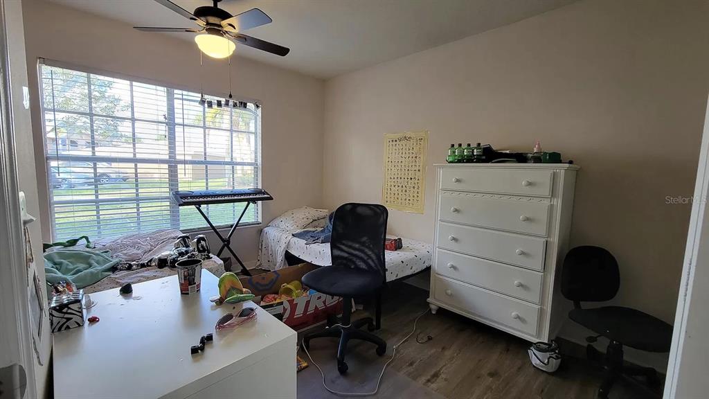 1830 Long Iron Drive, Unit 701 Rockledge, FL 32955 - Photo 8 of 18 a view of a workspace with furniture and a window