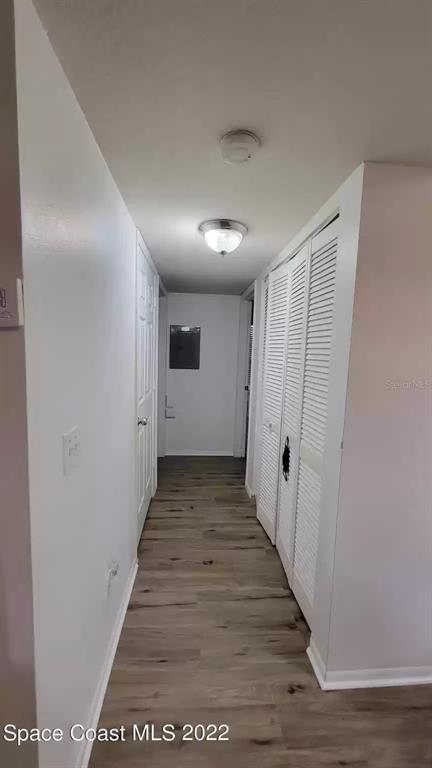 1830 Long Iron Drive, Unit 701 Rockledge, FL 32955 - Photo 10 of 18 a view of a hallway with wooden floor