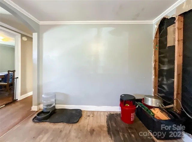 a room with a window and gym equipment