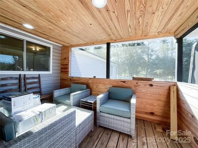 a view of a house with wooden deck