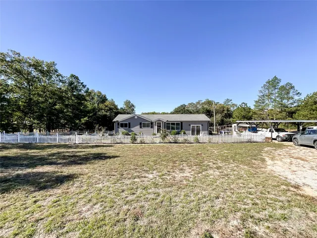 an aerial view of a yard with horses