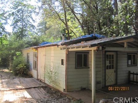 a view of a house with a tree
