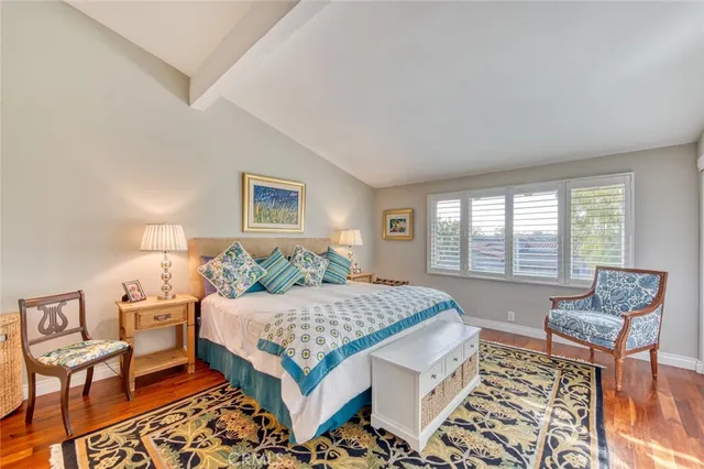 a view of a dining room with furniture and a chandelier