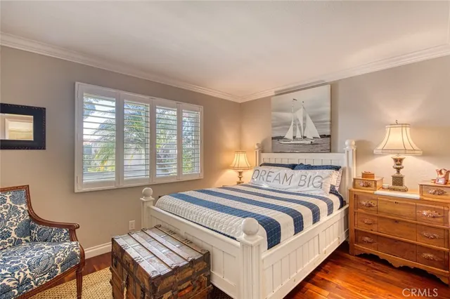 a bedroom with furniture and a book shelf