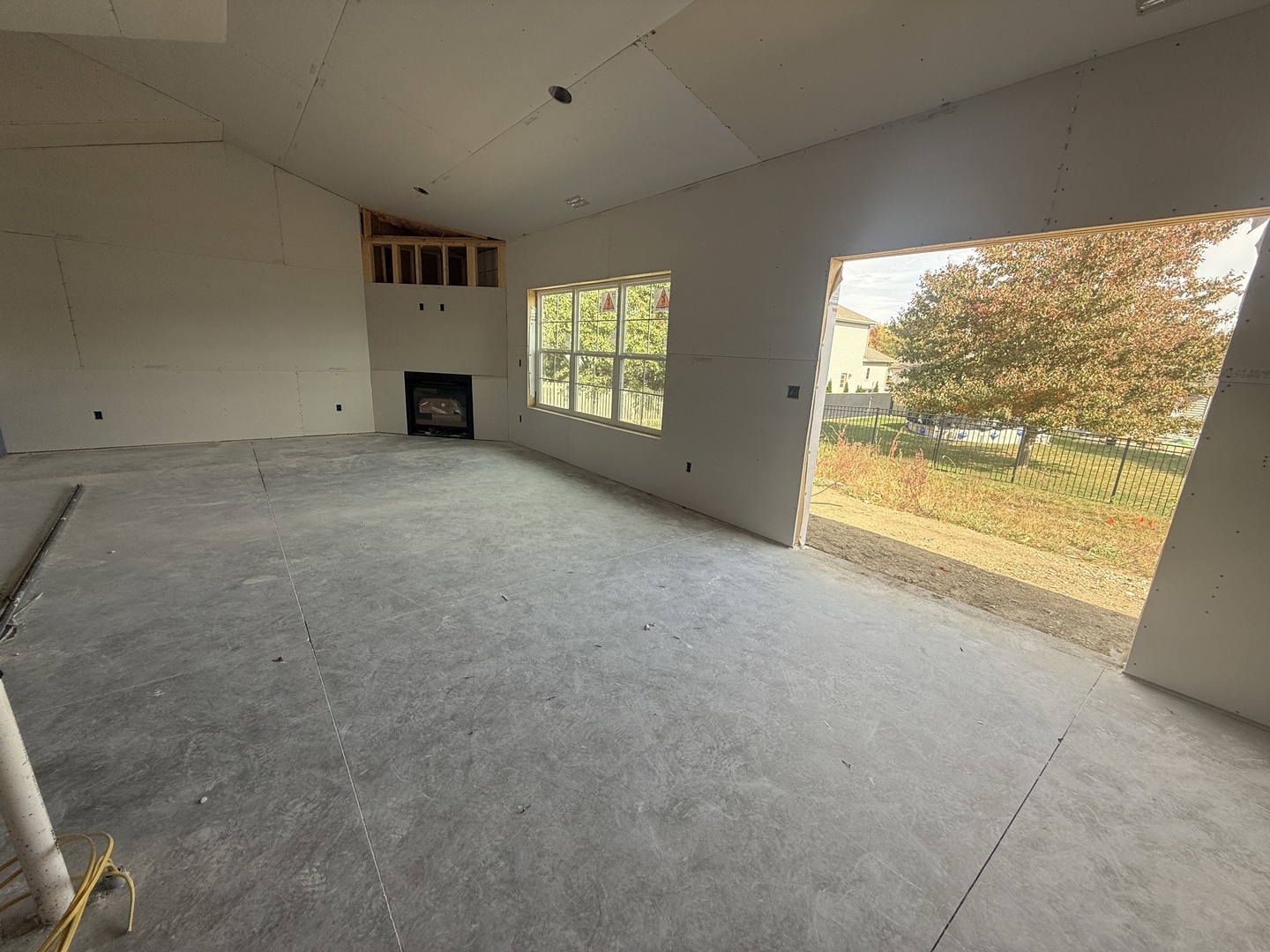 3310 Melissa Lane Urbana, IL 61802 - Photo 14 of 17 an empty room with a fireplace and large windows