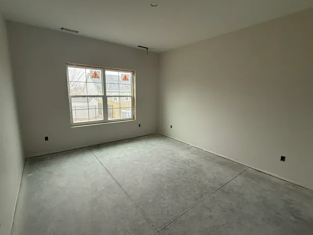 wooden floor and window in an empty room