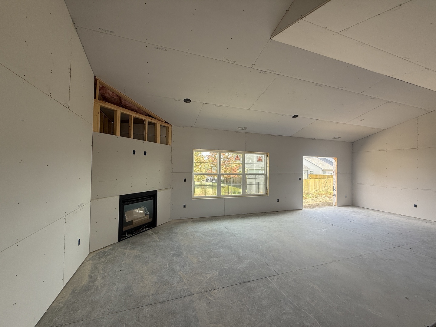 3310 Melissa Lane Urbana, IL 61802 - Photo 8 of 17 a view of empty room with a fireplace and window