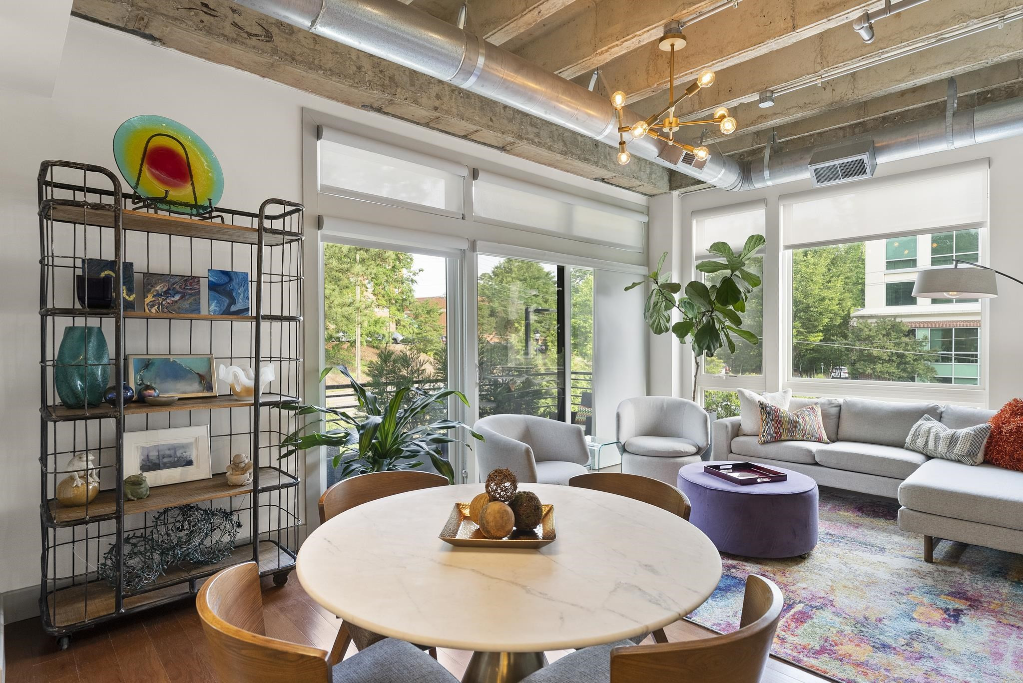 1300 St Marys Street, Unit 306 Raleigh, NC 27605 - Photo 11 of 30 a living room with furniture and a floor to ceiling window