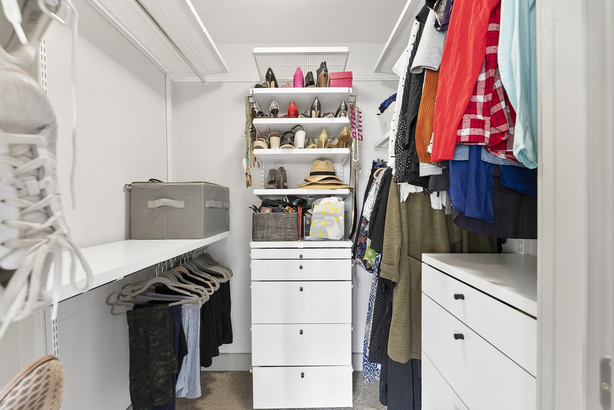 1300 St Marys Street, Unit 306 Raleigh, NC 27605 - Photo 21 of 30 a view of walk in closet with clothes and shoes