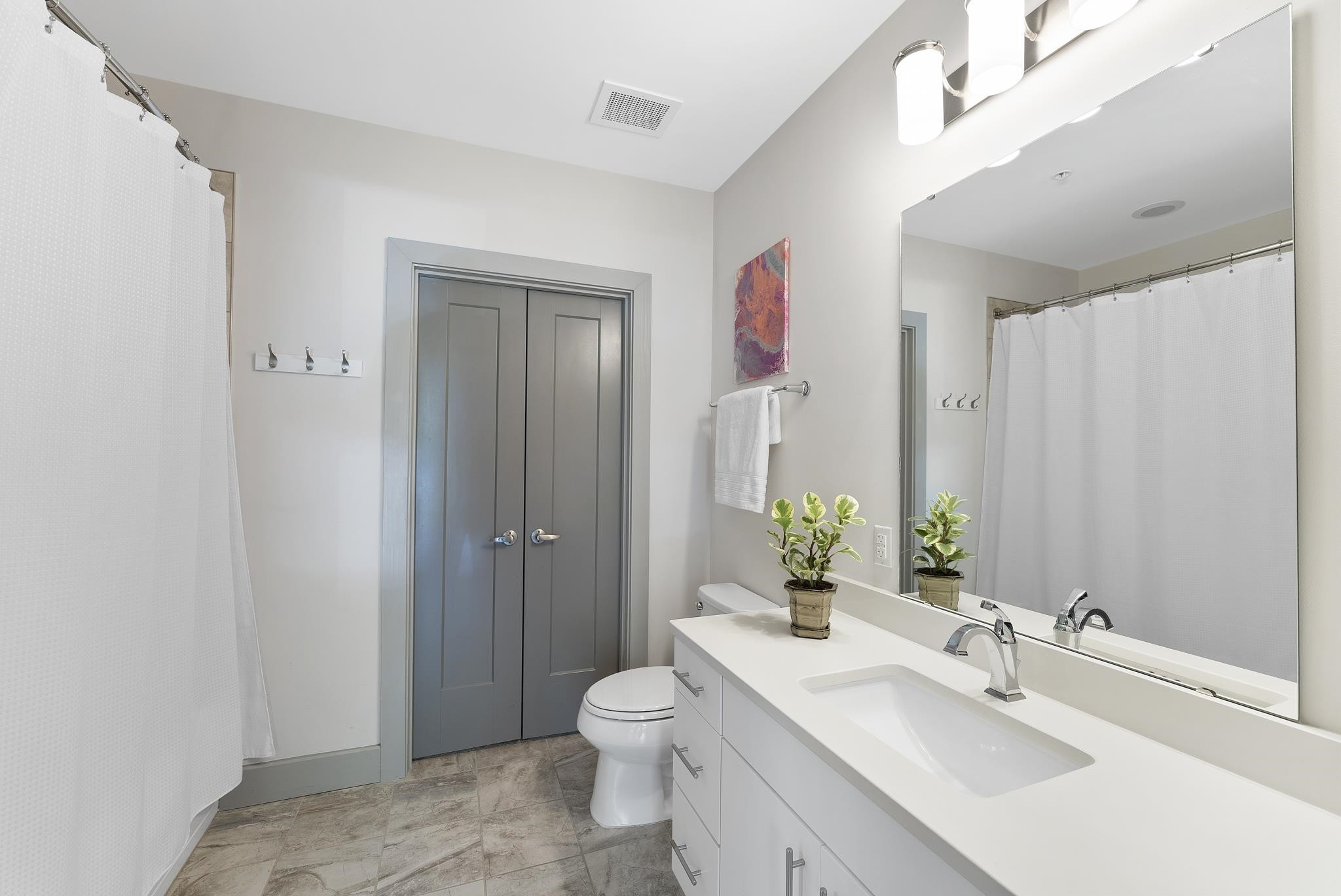 1300 St Marys Street, Unit 306 Raleigh, NC 27605 - Photo 23 of 30 a bathroom with a sink a toilet and shower