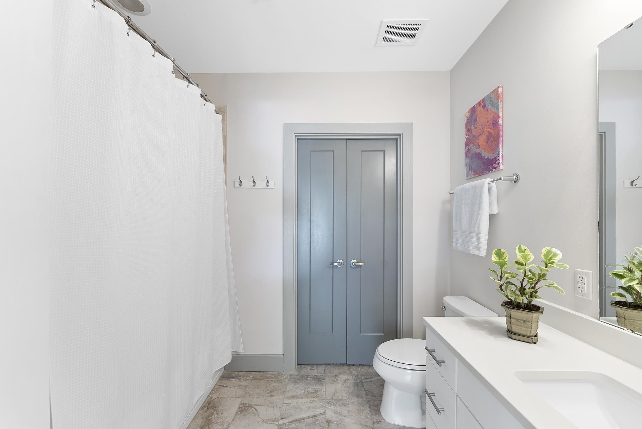1300 St Marys Street, Unit 306 Raleigh, NC 27605 - Photo 24 of 30 a bathroom with a toilet sink and vanity