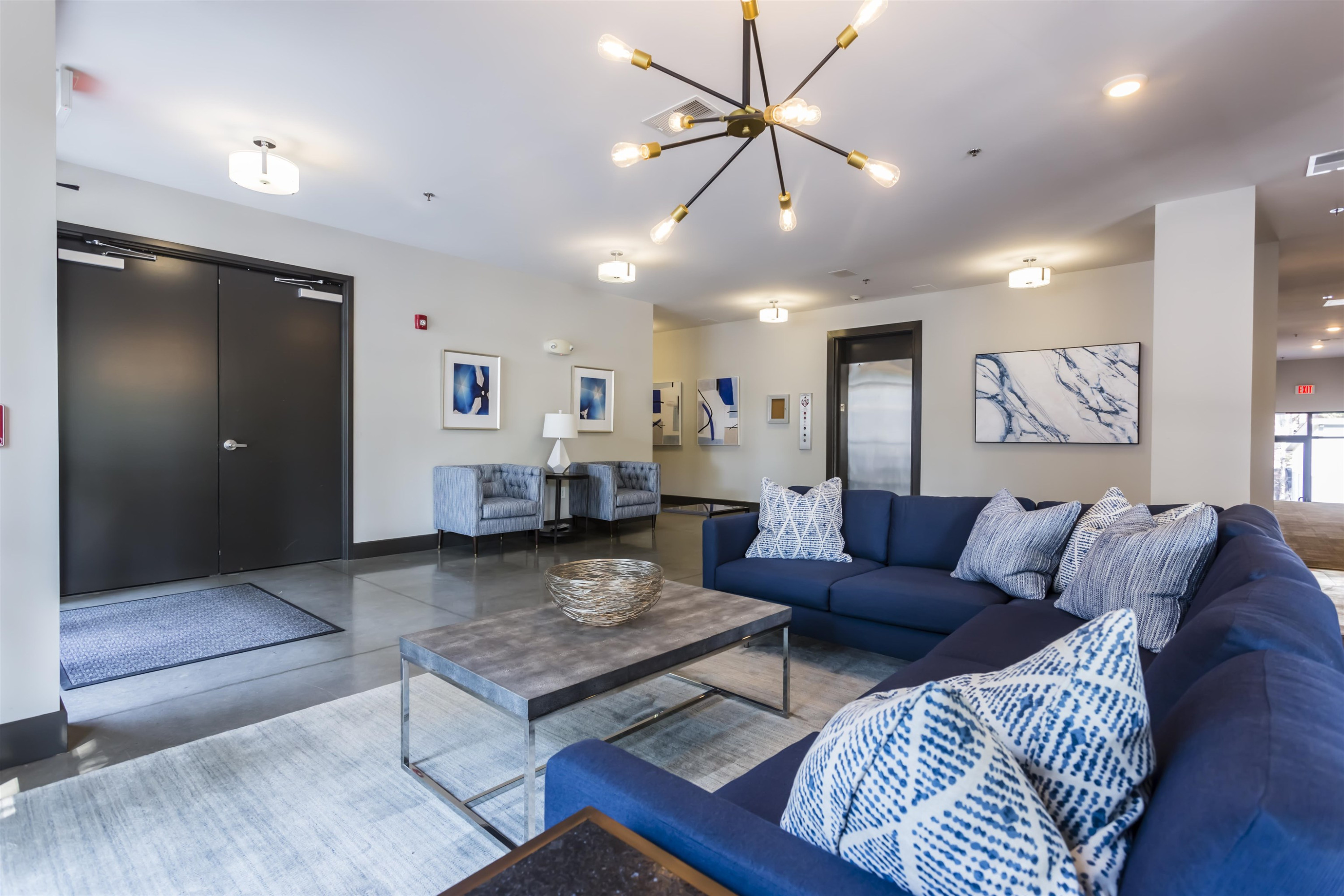 1300 St Marys Street, Unit 306 Raleigh, NC 27605 - Photo 27 of 30 a living room with furniture and a ceiling fan