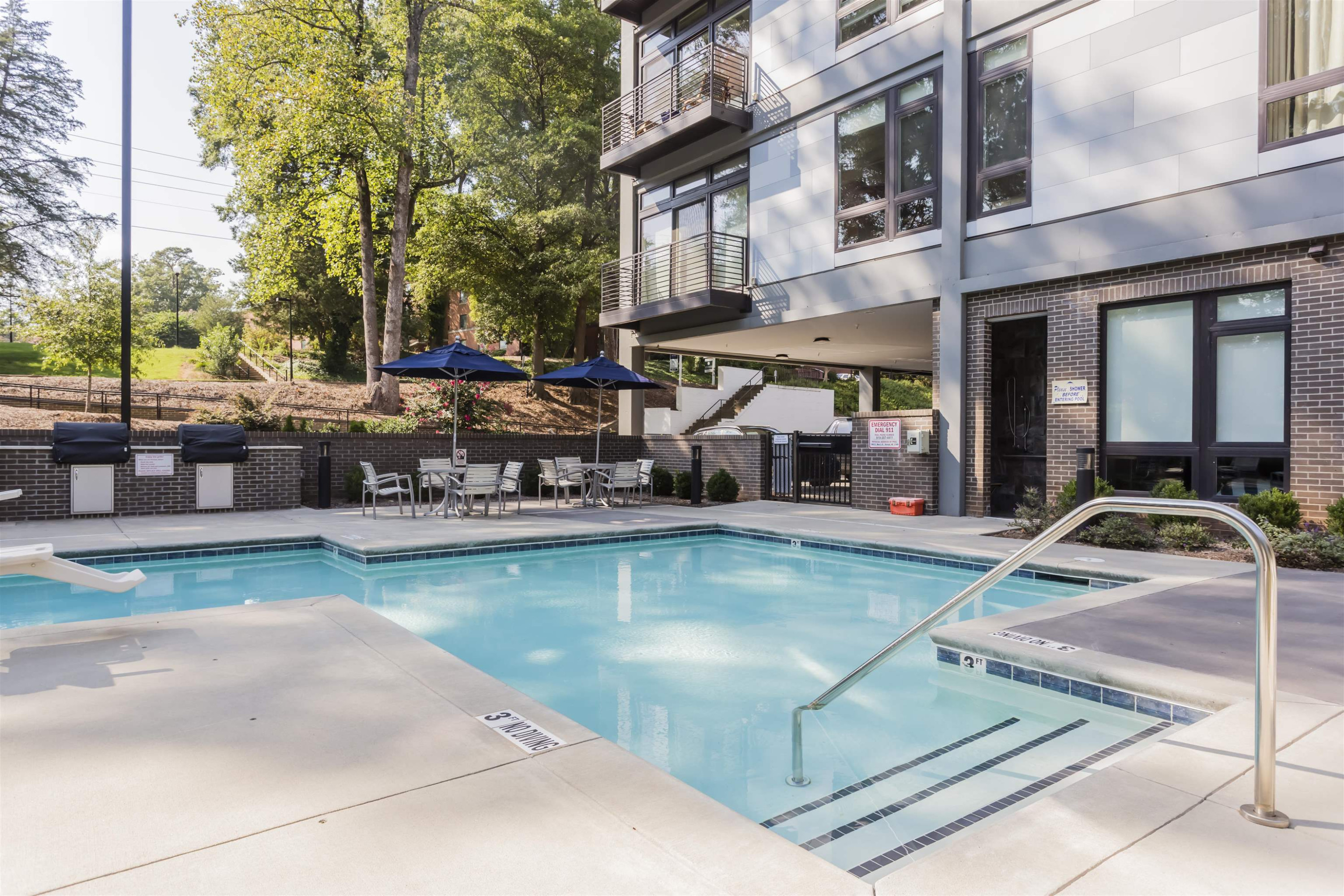 1300 St Marys Street, Unit 306 Raleigh, NC 27605 - Photo 30 of 30 a view of a swimming pool with sitting area