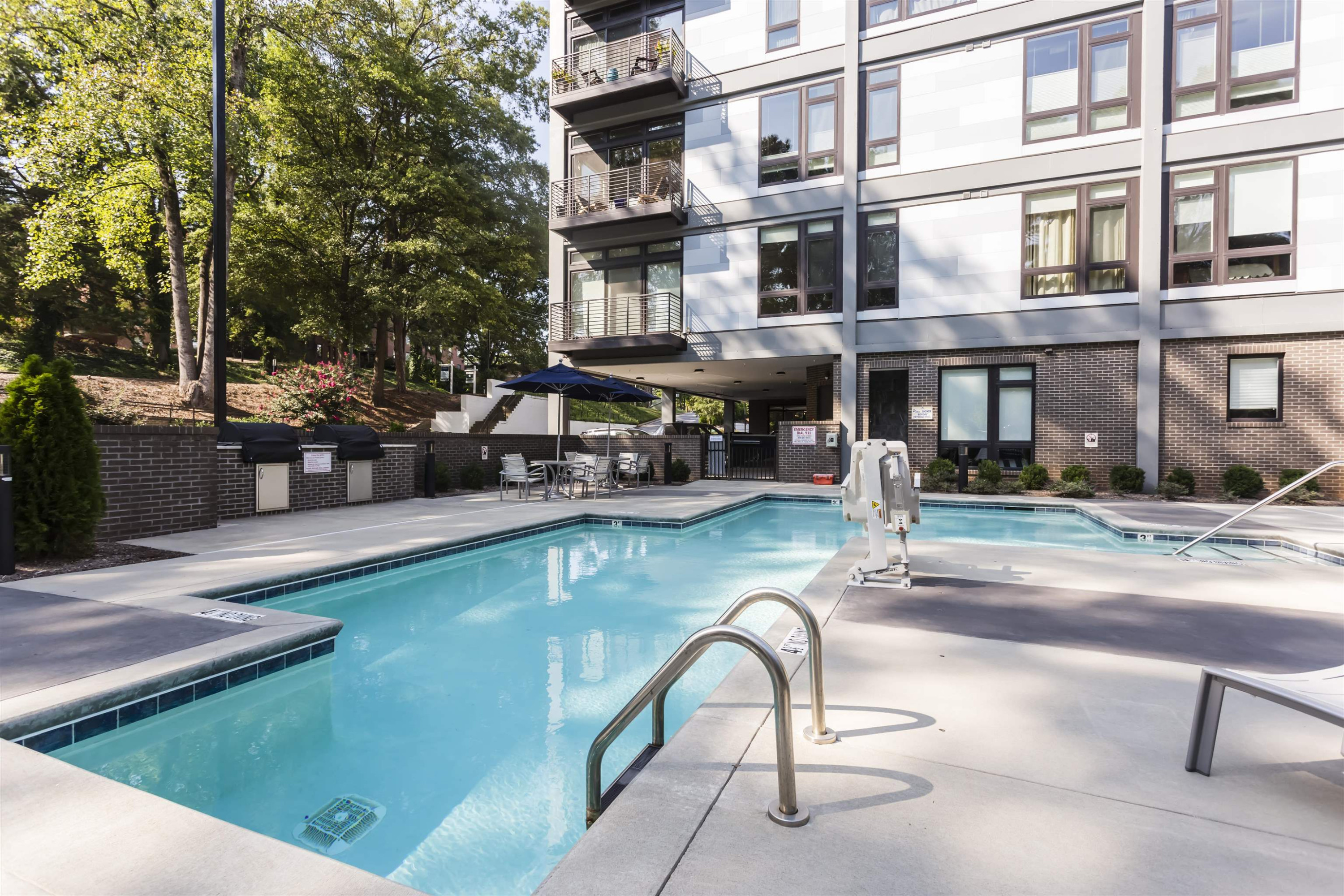 1300 St Marys Street, Unit 306 Raleigh, NC 27605 - Photo 6 of 30 a swimming pool view with a outdoor seating