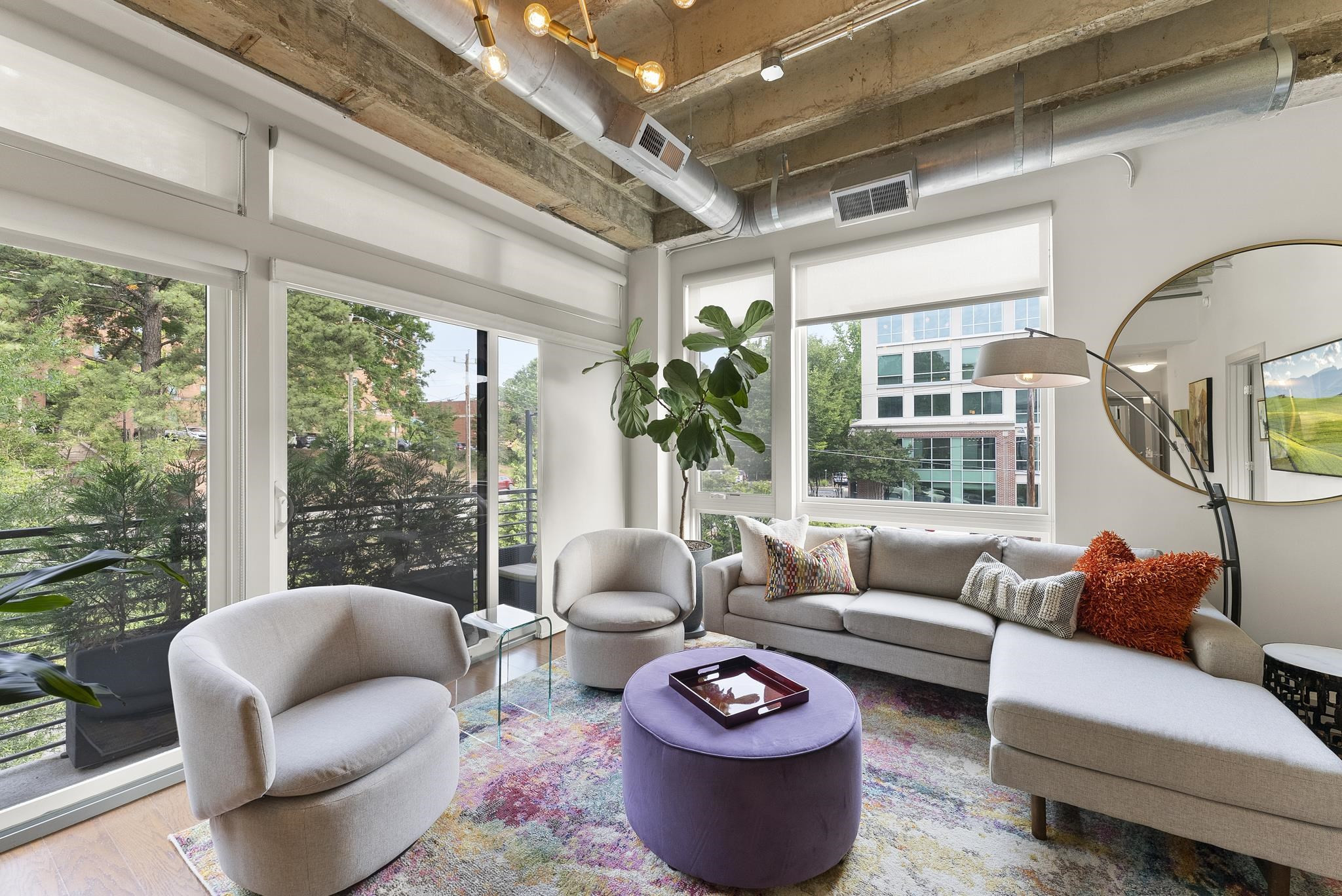1300 St Marys Street, Unit 306 Raleigh, NC 27605 - Photo 8 of 30 a living room with furniture and a large window