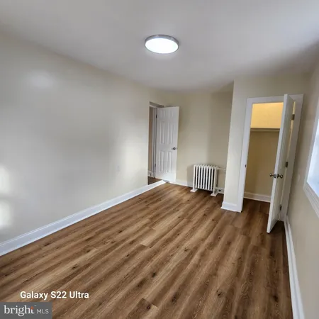 a view of a room with wooden floor and staircase