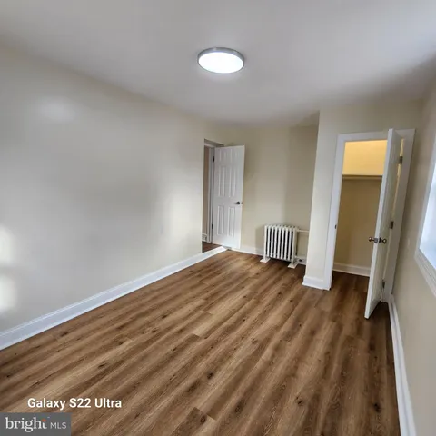 a view of a room with wooden floor and staircase