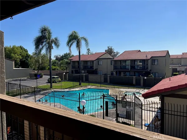 a view of a swimming pool with a lounge chair