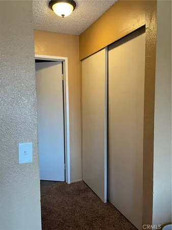 a view of a room with a glass door