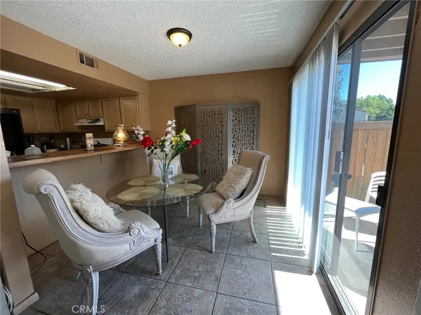 a dining room with furniture and window