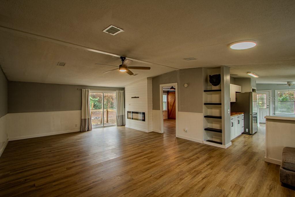 448 Southwest Central Terrace Fort White, FL 32038 - Photo 11 of 19 a view of an empty room with wooden floor and a window