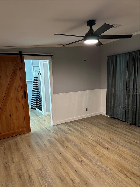 448 Southwest Central Terrace Fort White, FL 32038 - Photo 17 of 19 a view of an empty room with wooden floor and a window